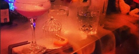 Dry ice smoking between cocktails on a bar.