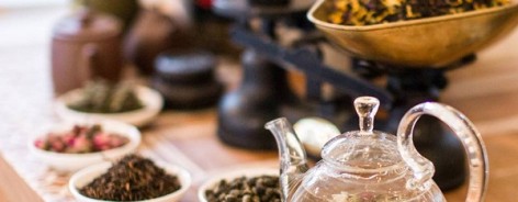 Pots of loose leaf teas and a weighing scales