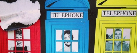 Brightly coloured print of postboxes with balck and white photos of famous women inside