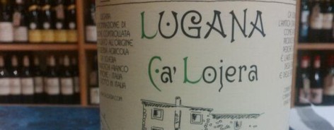 Bottle of Lugana wine with leaping wolf design