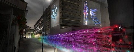 Long exposure shot of the Ghost Peloton, with bikes in neon colours.
