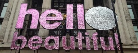 Photo of a glitter sign saying 'hello beautiful'