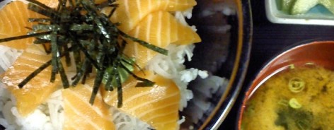 Bowl of rice with salmon pieces