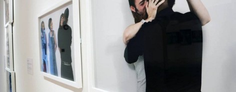 Photo of Clifford kissing a male participant