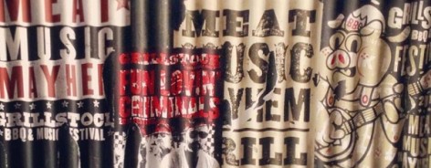 Posters on corrugated iron, advertising Grillstock.