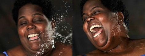 Woman being splashed with water
