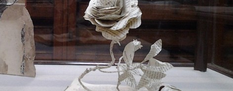 A rose cut from the pages of a book