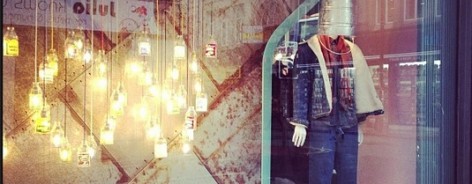Photo of the lights in Cow's window, spelling COW