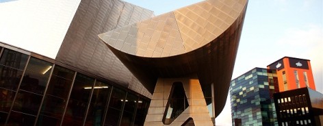 Photo of the The Lowry with a blue sky behind it