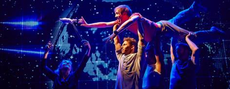 Photo from the production, with Christopher being carried
