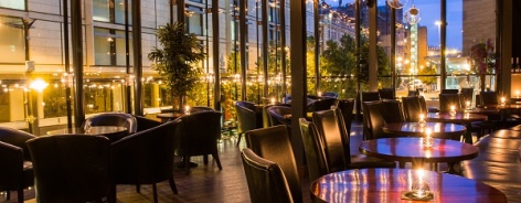Photo of the bar's dimly lit tables