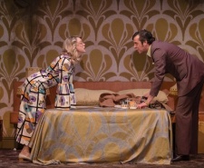 Photo of a man and a woman on either side of a bed