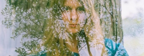 Photo of Lydia looking through the window
