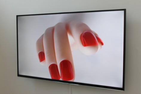Still from film of fake hand