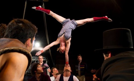 Woman balances on man's head