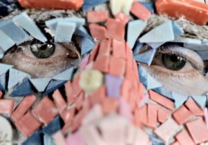 The Starry Messenger by Bedwyr Williams - photograph of a multi-coloured mask