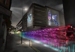 Long exposure shot of the Ghost Peloton, with bikes in neon colours.