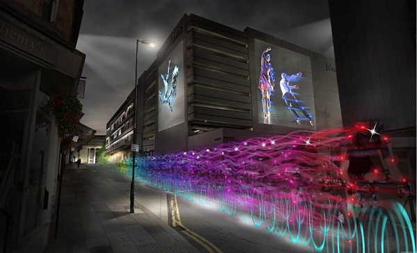 Long exposure shot of the Ghost Peloton, with bikes in neon colours.