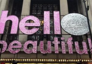 Photo of a glitter sign saying 'hello beautiful'
