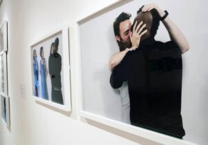 Photo of Clifford kissing a male participant