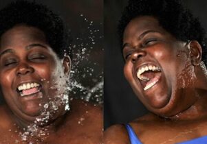 Woman being splashed with water