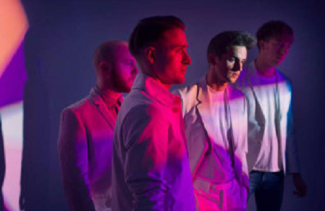Pink and purple photo of band members from Wild Beasts