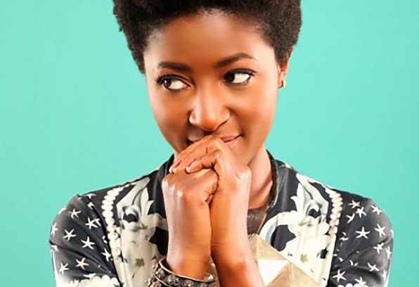 Photo of singer-songwriter Josephine against a turquoise background
