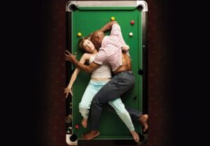 Photo from above of Othello and Desdemona on a pool table