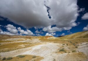Photo of a yellowand great landscape with great clouds in a blue sky