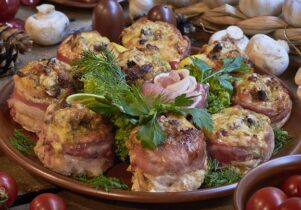 Photo of a dish of meat dumplings surrounded by fresh veg