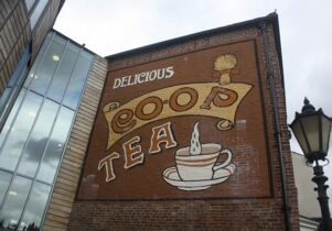 Photo of the co-op tea sign on the building