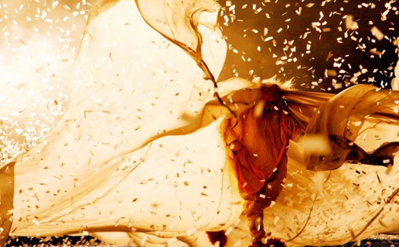 Photo of a man with billowing material around him