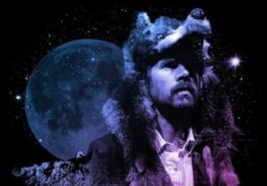 Photo of Gruff in wolf head with moon behind