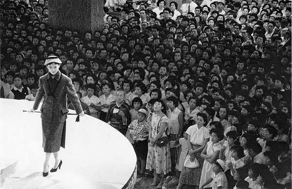 Photo of a woman modelling on a circular stage