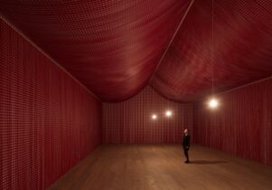 Photo of the red poppy cutouts in Cornelia Parker's War Room