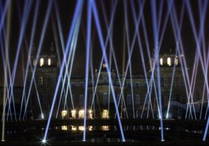 Photo of blue lasers coming from the ground