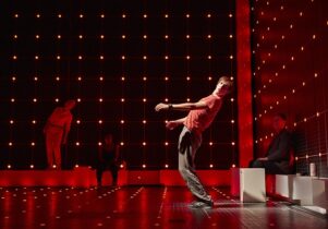 Shot of the stage with a boy in a red t-shirt leaning backwards