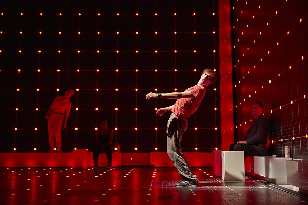 Shot of the stage with a boy in a red t-shirt leaning backwards