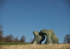 Photo of bronze forms against blue sky