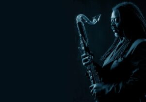 Black and blue photo of Courtney Pine
