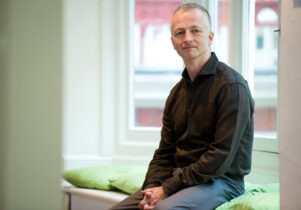 Photo of John McGrath in a black shirt