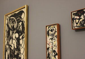 Three frames on a grey wall