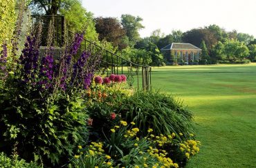 Flower beds beside a wide lawn
