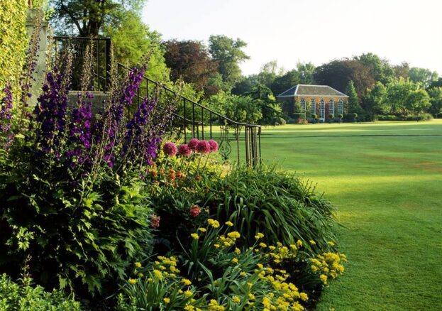 Flower beds beside a wide lawn