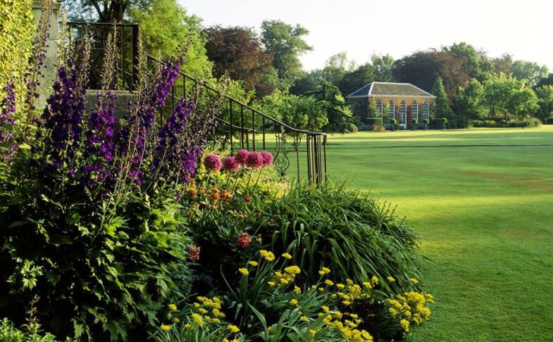 Flower beds beside a wide lawn