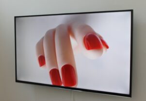 Still from film of fake hand