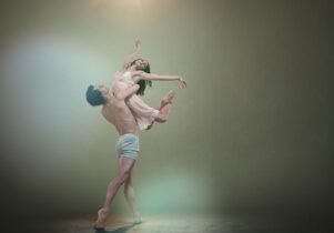 Man lifts woman in ballet move