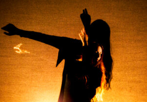 Photo of a dancer lit gold