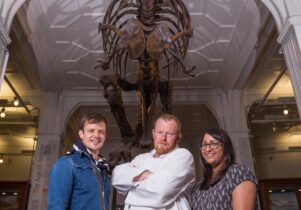 Chef Robert Owen Brown and collaborators beneath whale skeleton