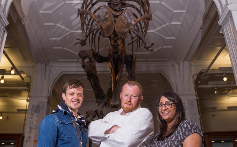 Chef Robert Owen Brown and collaborators beneath whale skeleton